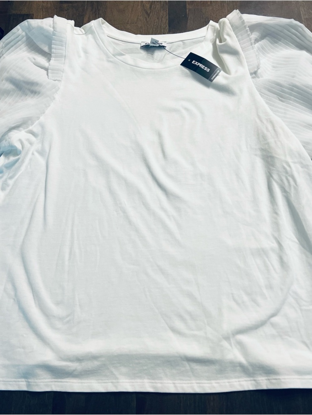 NWT Express White top with Shear Piping Ruffles on the sleeves. Size L